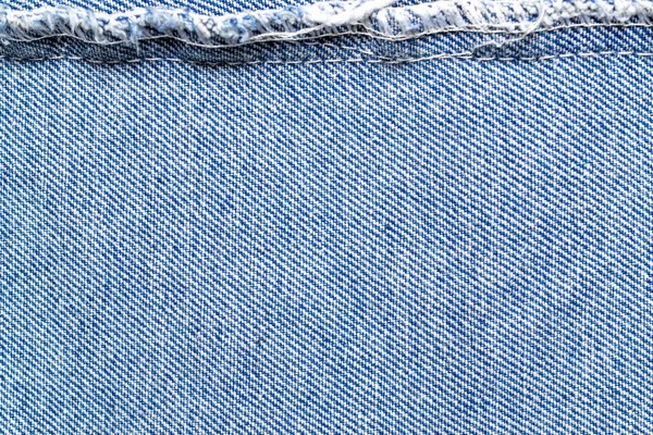 Погляд на синій фон зблизька. Структура Жана деніма для одягу моди з копіювальним простором. Текстильна тканина — стокове фото