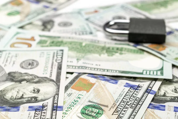 Money saved. American money. Washington American cash with padlock isolated on white, usd background.