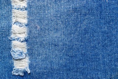 Denim doku arka planı. Blue Jeans tekstil desenini yakından çek. Moda kumaşı için kopya alanı olan çivit kumaş malzemesi