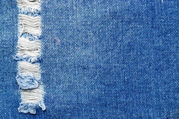 Jeansowe tło tekstury. Niebieskie dżinsy wzór tekstylny z bliska. Indygo materiał tkanina z miejsca na ksero tkanina moda — Zdjęcie stockowe
