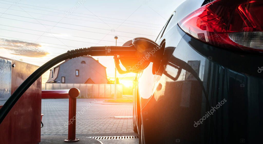 Fuel car. Pump petrol from nozzle in vehicle tank. Gasoline, oil gas station. Economy business with diesel transport. Automotive transportation concept.