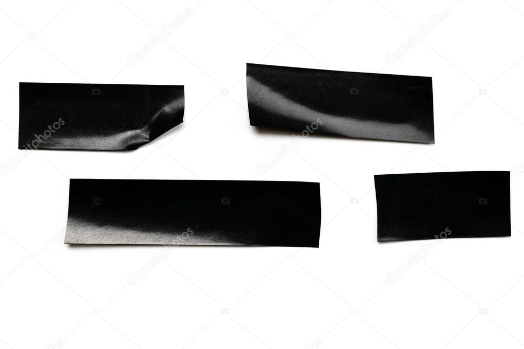 Adhesive sticky paper. Piece of black duct scotch tape isolated on white background. Torn strip grunge texture