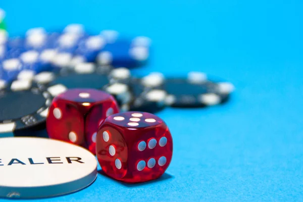 Descripcin: Game of dice on black background with dealer tab. Game of red dice on black background. Five red dice on black carpet and dealer card.