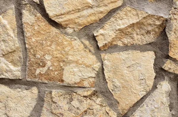 Duvar bej farklı şekiller taştan.