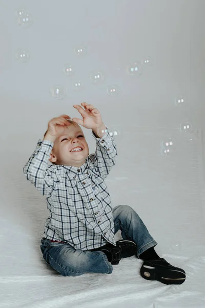 Little boy playing with soap bubbles Royalty Free Stock Images