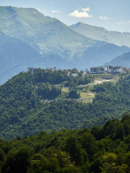 Hotel in the mountains among the green forest. Krasnaya Polyana, Sochi, Russia Royalty Free Stock Photos