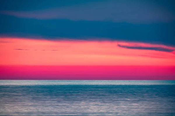Beautiful pink sunset over the sea.