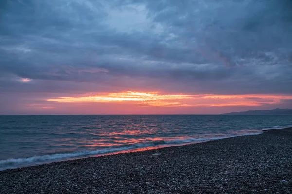 Beautiful pink sunset over the sea.