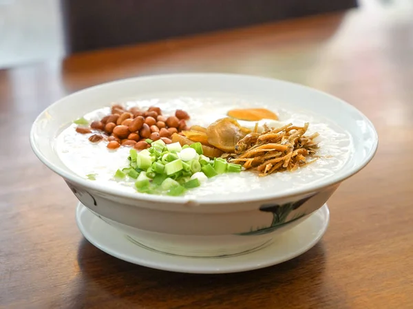 Rice Porridge Peanuts Spring Onion Vegetables Fried Anchovies Toppings — Stock Photo, Image
