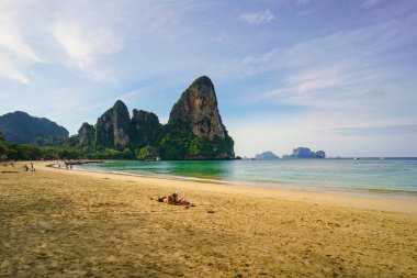 Railay Beach, Krabi, Thailand, 1st January 2019: Morning scene with long tail boats and tourists at lovely Railay beach.