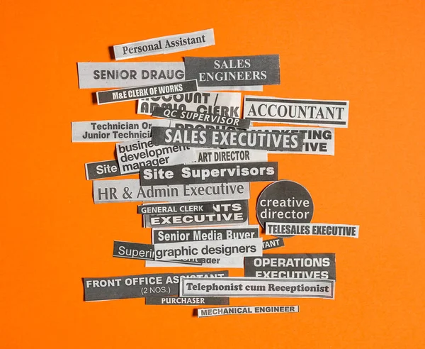 Jobs Careers Concept Multiple Job Titles Occupations Cut Newspaper Orange — Stock Photo, Image