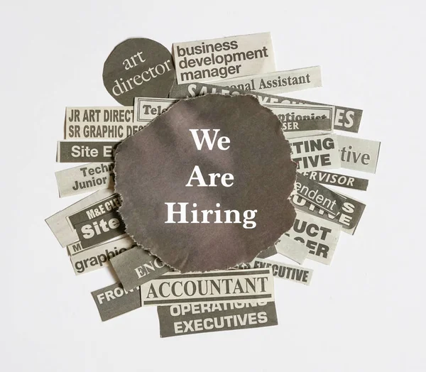 JOb opportunity concept- job titles or vacancies cut from newspapers on white with text, We Are Hiring on top of jobs
