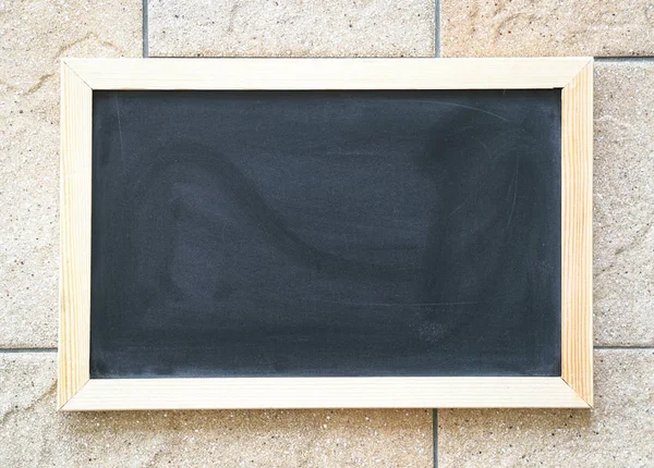 Blank used blackboard on tiles — Stock Photo, Image