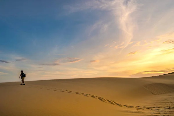 Explorer hiking on a desert