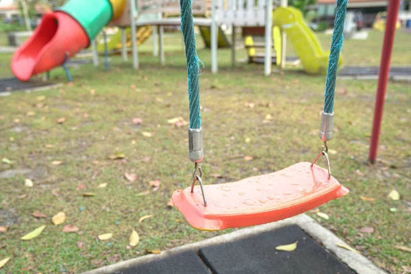 Empty playground swing — Stock Photo, Image