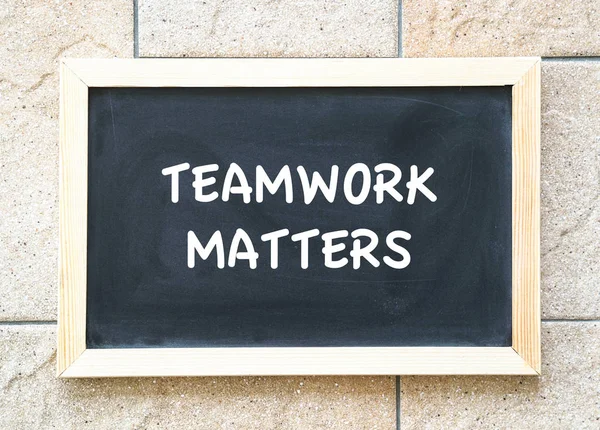 Teamwork matters, words on blackboard