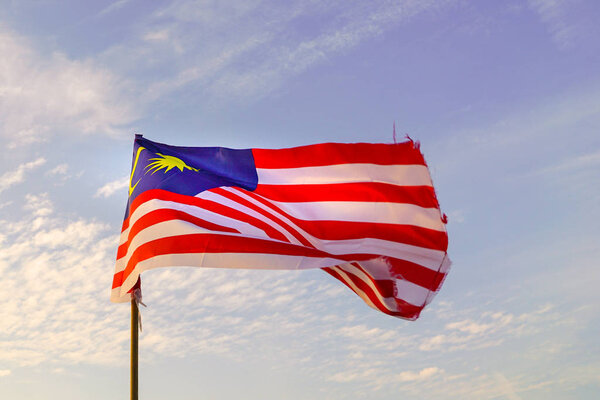 Malaysia flag waving in the morning sun