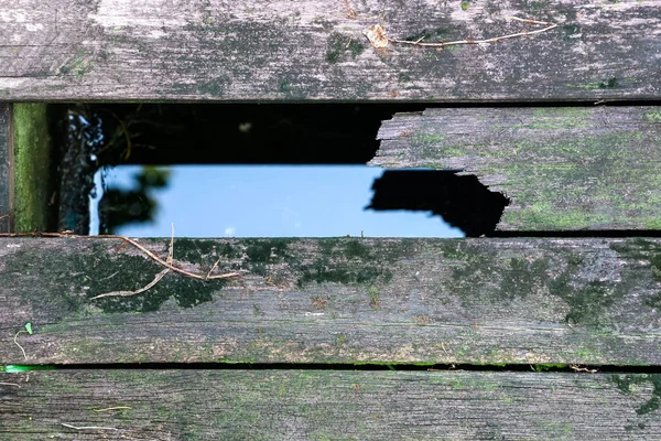 Concept de fond : vue de dessus des planches avec un trou — Photo