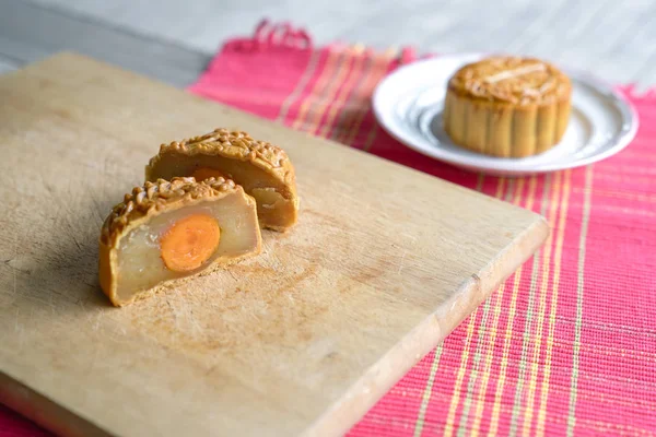 Moon cake cut into half with lotus paste and egg yolk flavor — Stock Photo, Image