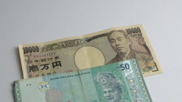 Banconote Giapponesi Yen Contro Malaysia Ringgit — Video Stock