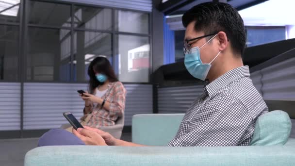 Two People Girl Man Wearing Face Mask Using Cellphone Sitting — Stock Video
