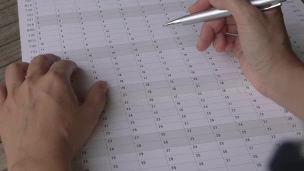 Woman Fingers Running Annual Calendar Planner Close View — Stock Video