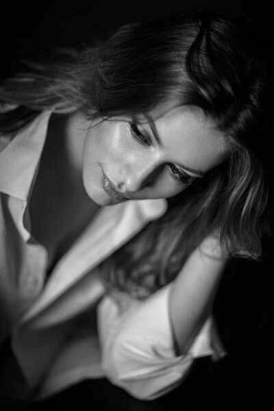 Classic portrait of sensual young woman in a simple clothes. Emotional close-up photo