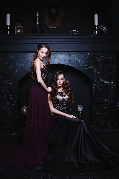 Twins Young Women Evening Dresses Fashion Beauty Portrait Dark Interior — Stock Photo, Image