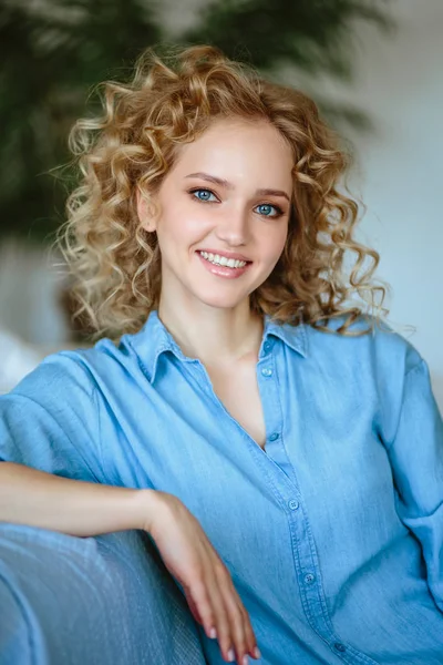 1970s SMILING YOUNG WOMAN WITH LONG BLOND CURLY HAIR STANDING HANDS ON HIPS  IN BELL BOTTOM DENIM BLUE JEANS - Stock Photo - Masterfile -  Rights-Managed, Artist: ClassicStock, Code: 846-05646989