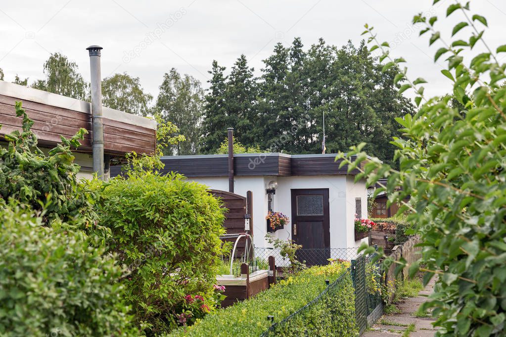 small garden houses on private plots in a suburb of a big city