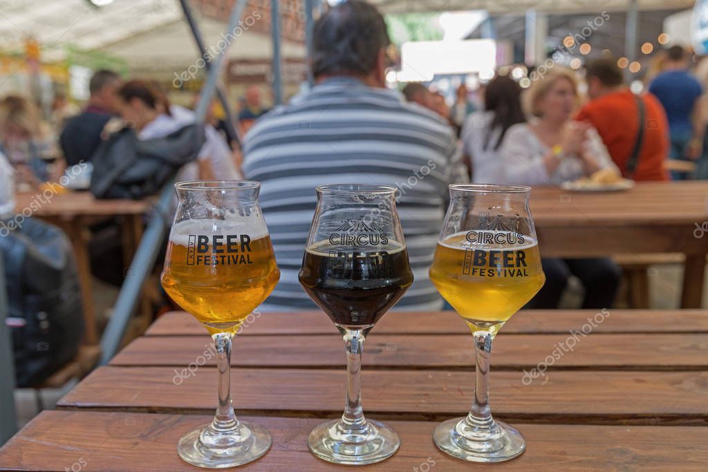 KYIV, UKRAINE - MAY 18, 2019: Glasses with different craft beers closeup at Kyiv Beer Festival vol. 4 in Art Zavod Platforma. More than 60 craft beer breweries were presented here.