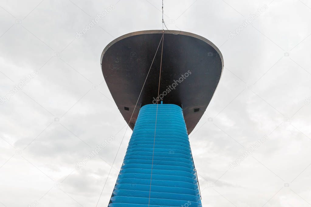 Cruise ship pipe against cloudy sky
