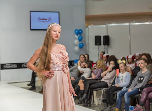 KYIV, UKRAINE - FEBRUARY 09, 2018: Fashion young girl teenager beautiful model at Kyiv Fashion 2018 in KyivExpoPlaza exhibition center. It is the main b2b event of Ukrainian fashion industry.