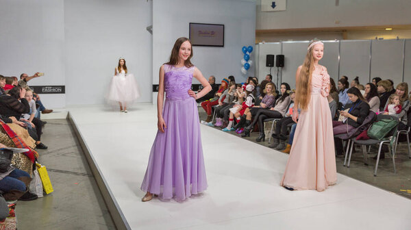 KYIV, UKRAINE - FEBRUARY 09, 2018: Fashion young girls teenager beautiful models at Kyiv Fashion 2018 in KyivExpoPlaza exhibition center. It is the main b2b event of Ukrainian fashion industry.