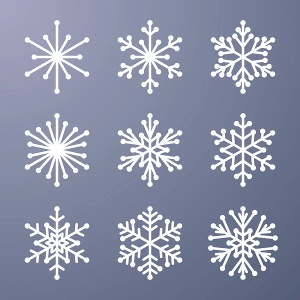 Ensemble de flocons de neige sur fond gris — Image vectorielle