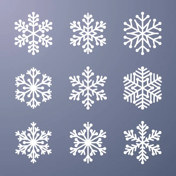 灰色の背景に雪の結晶のセット — ストックベクタ