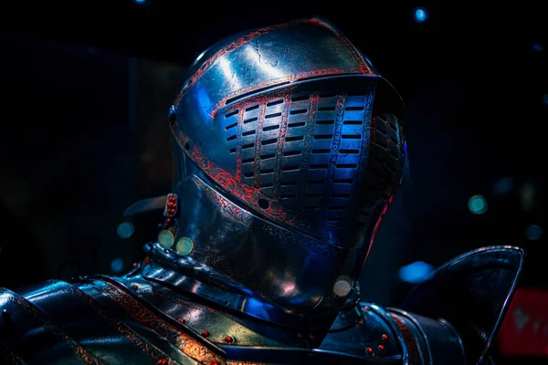 Medieval like armour suit and helmet glowing in the dark — Stock Photo, Image