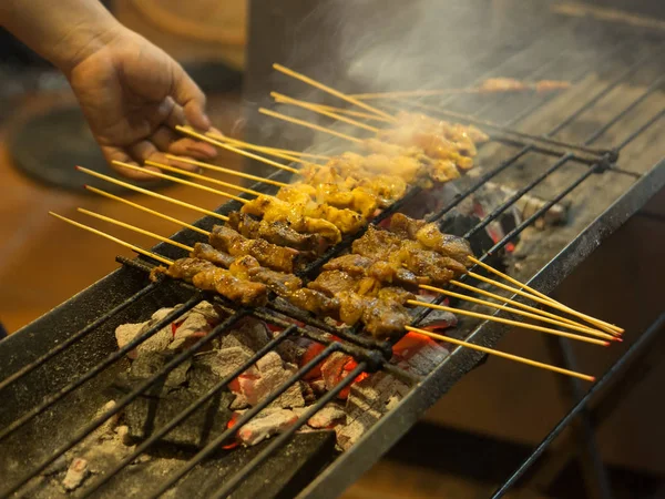 stock image Asian street Food. People cooking, selling and buying Exotic Asian Food (Thai, Malaysian, Chinese, Korean, Japanese). Exotic delicious Street food, especially seafood are very popular among tourists