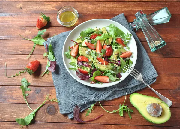 Avocado Salad Strawberries Blue Cheese Arugula Beet Leaves Wooden Background — Stock Photo, Image