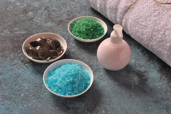 Spa and body care products. Colorful aromatic bath Dead Sea salt black Dead Sea Mud.. Natural ingredients for homemade body salt scrub. Dead Sea cosmetics. Beauty skin care. Spa treatment.