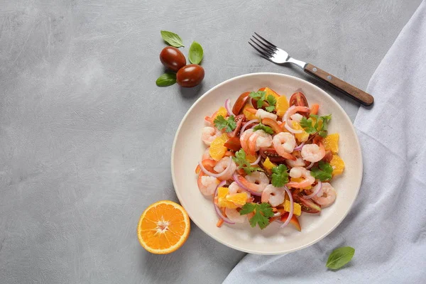 Refreshing dish of fish in citrus juice. Peruvian shrimp, prawn Ceviche marinated in oranges and lime. Diet and healthy food concept. Seafood salad