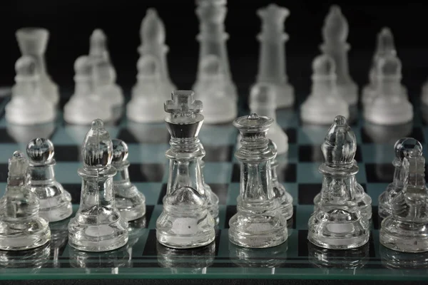 Clear Glass Chess Pieces Glass Chessboard Isolated Black Background — Stock Photo, Image