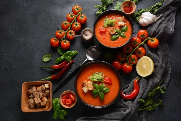 stock image Andalusian gazpacho. Red tomato cold gazpacho soup in glass, with cucumber, onion, basil ,chili peppers and croutons.