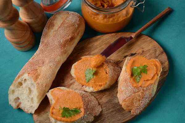 Squash puree (squash caviar) in a glass jar and on  slices of bread.Homemade caviar of vegetables