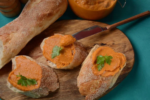 Squash puree (squash caviar) in a glass jar and on  slices of bread.Homemade caviar of vegetables