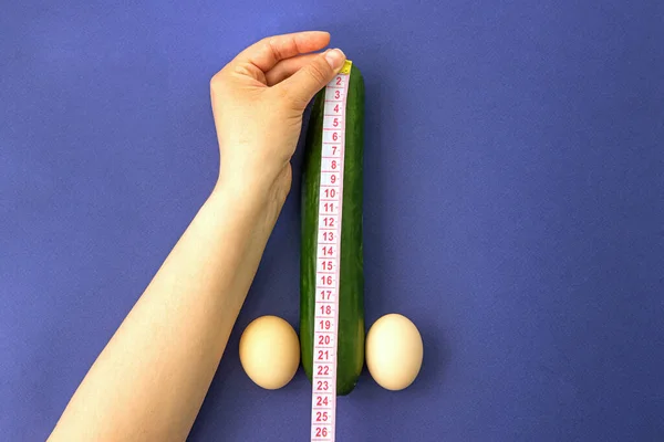 Cucumber Eggs Blue Background Woman Hands Measure Length Penis Concept — Stock Photo, Image