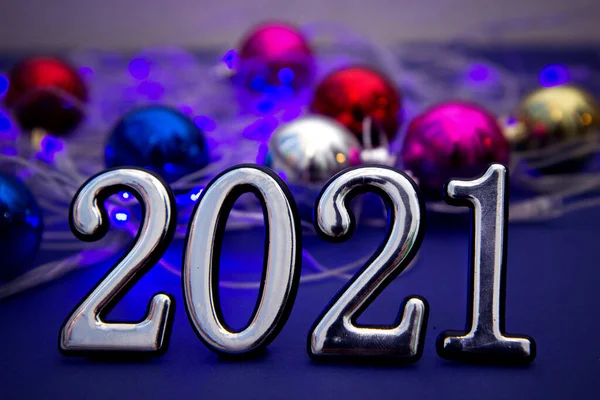 Happy new year 2021. Silver numbers. Year of the bull. Blurred blue light background. greeting card