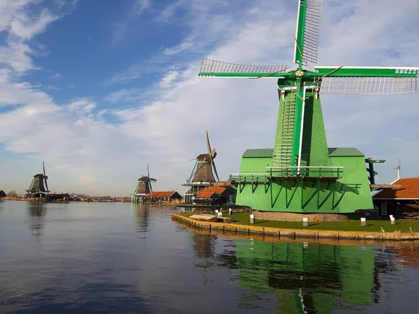 The Dutch Dutch suburb of Zaansche Schans. The water channels, the serene climate and the typical windmills.