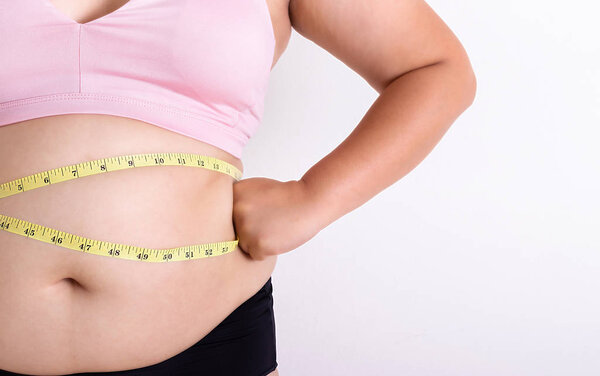 Женский жир с мерной лентой. Концепция здравоохранения
.