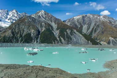 Giant floating icebergs on Tasman Glacier Lake in Aoraki Mount C clipart